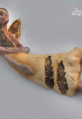 ANIOŁ ZŁOTOSKRZYDŁY FIGLARNY