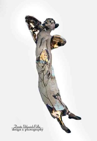 ANIOŁ SZAMOTOWY ZACIEKAWIONY