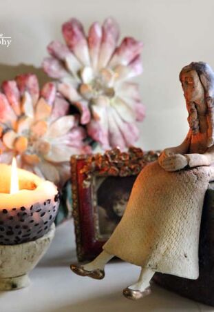 ANIOŁ NA KOSTCE RAKU 